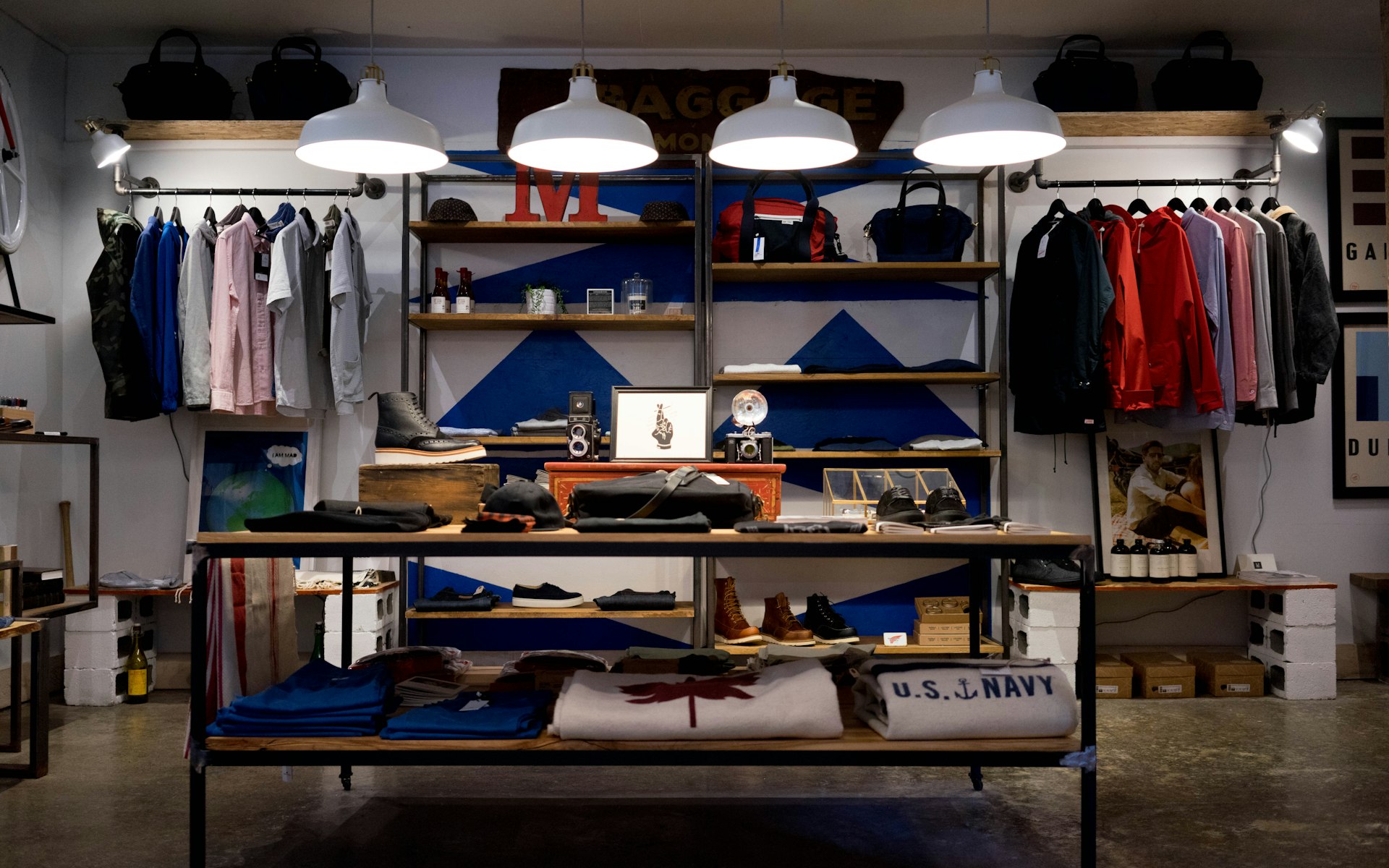 A boutique rail of garments in warm light